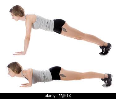 Ritratto di giovane sorridente slim bella donna facendo esercizi di fitness sul tappetino, il riscaldamento, push-ups, lunghezza completa studio isolato Foto Stock