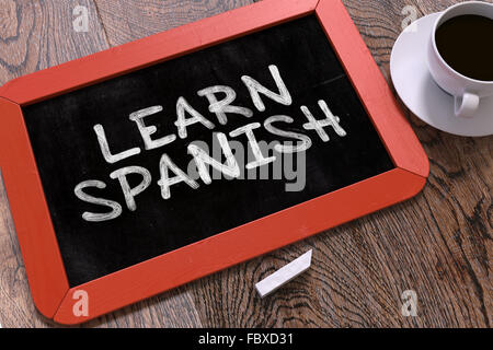 Imparare Spagnolo concetto disegnati a mano sulla lavagna. Foto Stock