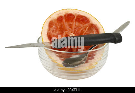 Resti di un pompelmo rosso con coppa Foto Stock