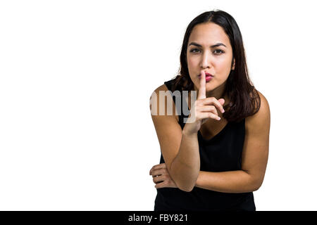 Ritratto di donna con il dito sulle labbra Foto Stock