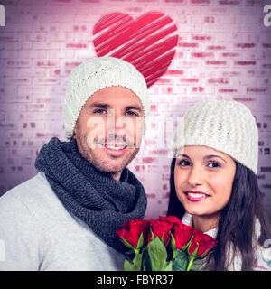 Immagine composita di sorridere giovane azienda bouquet di rose Foto Stock