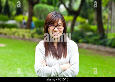 Felice donna asiatica Foto Stock