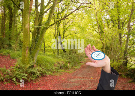 Immagine composita di imprenditore tenendo fuori mano nella presentazione Foto Stock