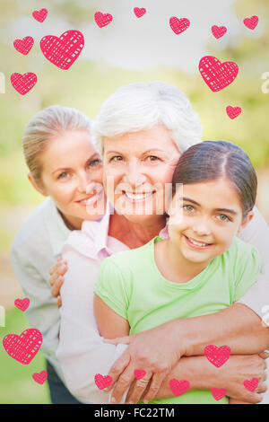 Immagine composita della famiglia adorabile nel parco Foto Stock