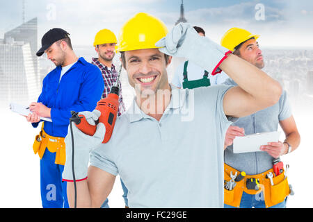 Immagine composita di bello architetto azienda macchina seminatrice Foto Stock