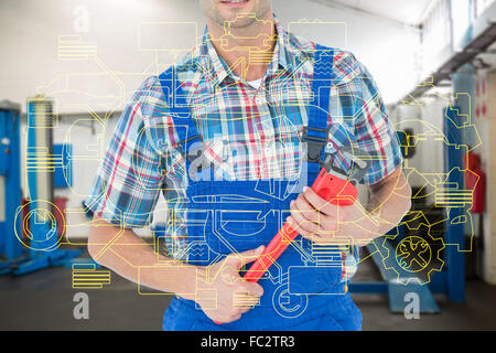 Immagine composita di immagine ritagliata di plumber holding Monkey Wrench Foto Stock