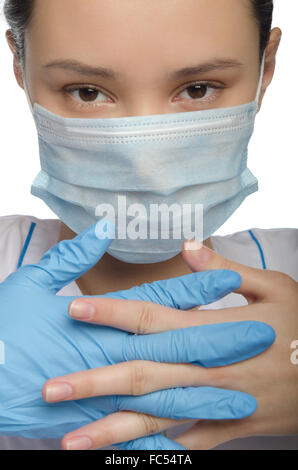 Medico mani guantate piegato Foto Stock