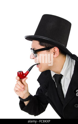 I giovani detective in cappotto nero tenendo la lente di ingrandimento isolato Foto Stock