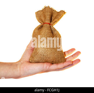Piccolo sacco di denaro con la mano isolato su bianco Foto Stock