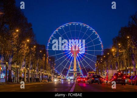 Ruota Panoramica SULLA PLACE DE LA CONCORDE e decorazioni di Natale, AVENUE DES CHAMPS ELYSEES DI PARIGI Foto Stock