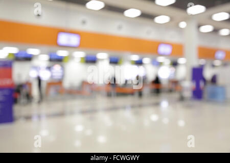 Bokeh di banchi per il check-in in aeroporto - sfondo sfocato Foto Stock