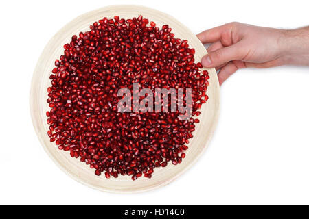 Piastra completa di pelati i semi di melograno Foto Stock