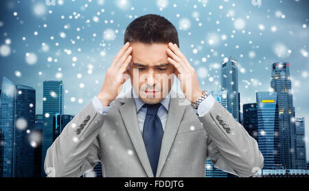 Imprenditore della tuta con il mal di testa Foto Stock