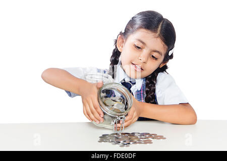 1 persona solo la caduta delle monete girl kid salvadanaio rupie scuola studente seduto Foto Stock