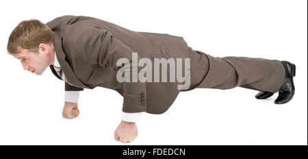Imprenditore facendo push-up su a suon di pugni Foto Stock