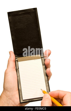 Mano con matita in piccoli Notebook vuoto Foto Stock