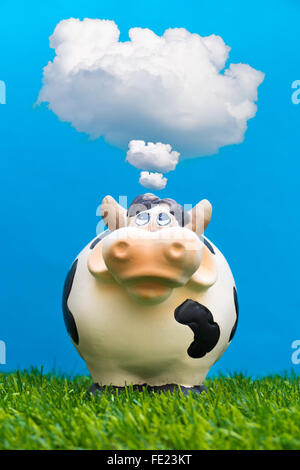 Mucca con bolla di Cloud Foto Stock