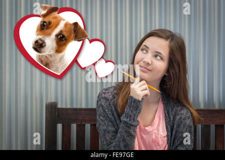 Fantasticando Cute girl accanto a cuori flottante con cucciolo all'interno. Foto Stock