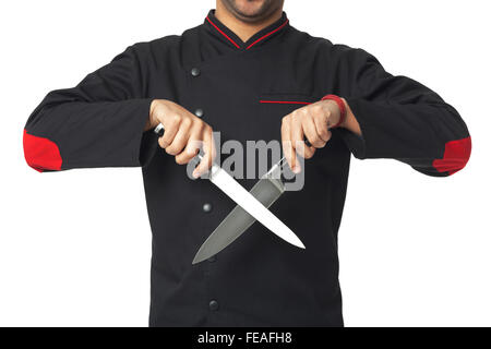 Afro American cuoco professionista azienda coltelli- isolato su sfondo bianco. Foto Stock