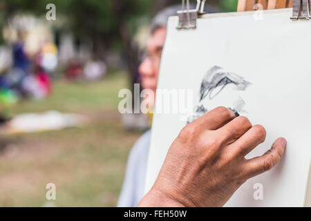 Mano è la gente di disegno nelle sedi. Foto Stock