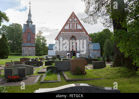 Il cimitero e la chiesa di San Lorenzo a Vantaa, Finlandia Foto Stock