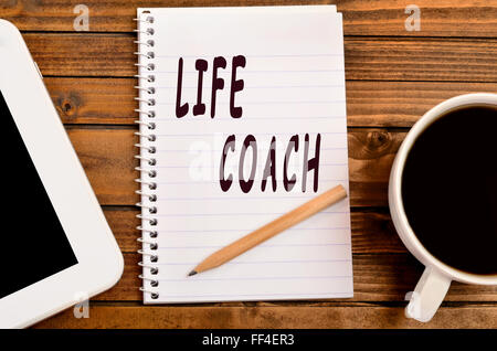 Life Coach parole su notebook Foto Stock