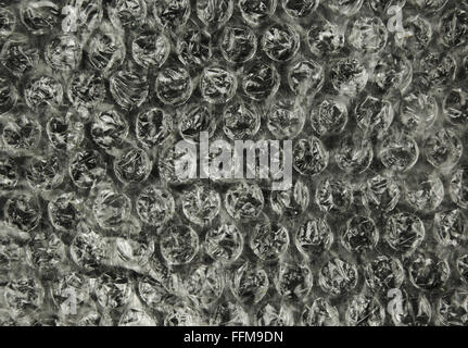 Un foglio di lamina di bolla con chiaramente visibili delle bolle e la loro struttura, interessante background e texture. Chiudere , orizzontali Foto Stock