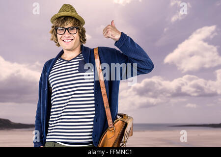 Immagine composita di sorridere hipster rendendo pollice in alto Foto Stock