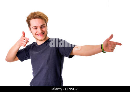 Sorridente giovane dita di puntamento. Studio shot, isolato Foto Stock