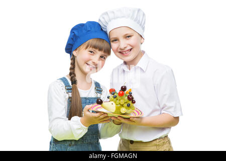 I bambini di contenimento forma hedgehog snack di frutta Foto Stock