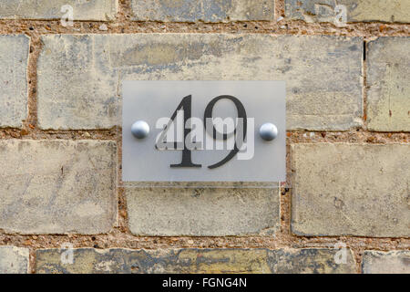 Il numero civico 49 segno sulla parete Foto Stock