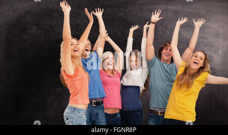 Immagine composita di una jumping happy gruppo tifo Foto Stock