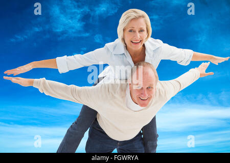 Immagine composita di felice coppia matura divertendosi Foto Stock