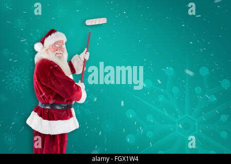 Immagine composita di Babbo Natale dipinge una parete Foto Stock