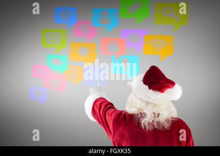 Immagine composita di santa claus punti a qualcosa di Foto Stock