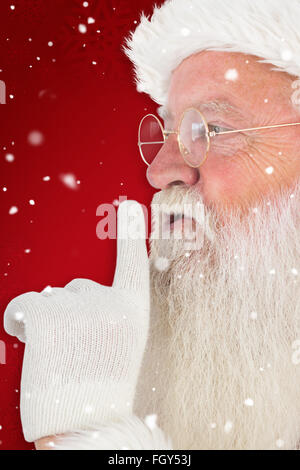 Immagine composita di santa claus facendo segno tranquilla Foto Stock