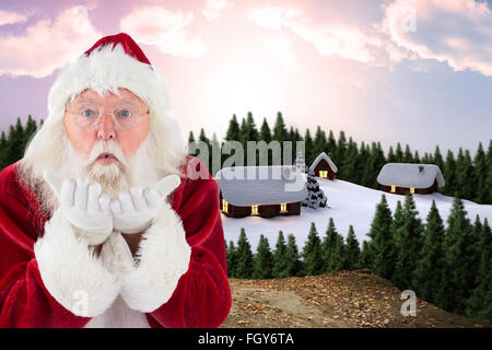 Immagine composita di santa claus soffia via qualcosa Foto Stock