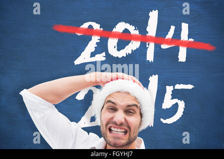 Immagine composita di festosa uomo con i regali di natale Foto Stock
