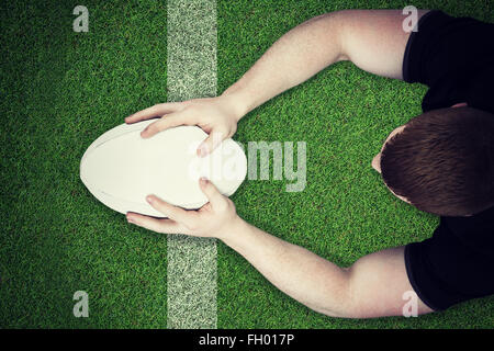 Immagine composita di un giocatore di rugby con un punteggio provare Foto Stock