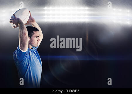 Immagine composita dei delusi giocatore di rugby tenendo la sua testa Foto Stock