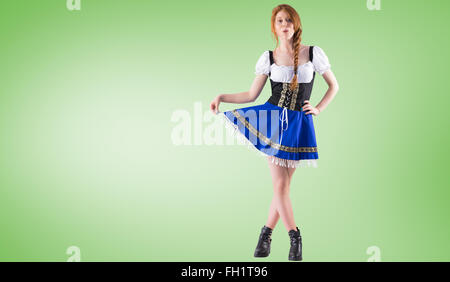 Immagine composita di oktoberfest ragazza espandendo il suo mantello Foto Stock