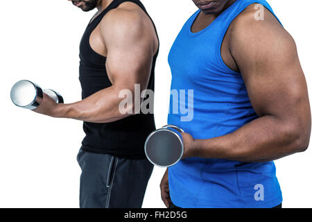 Forte amici in posa con manubri Foto Stock