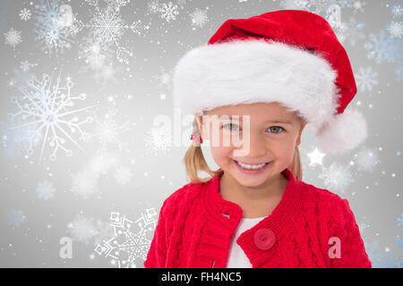 Immagine composita della cute bambina indossa santa hat Foto Stock