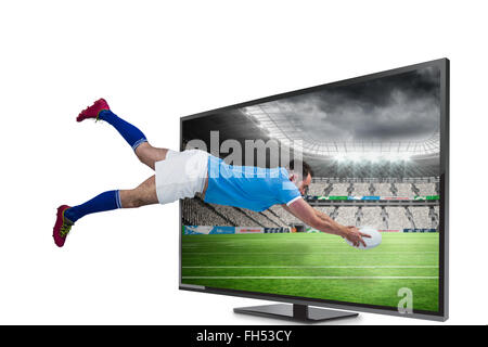 Immagine composita del giocatore di rugby con un punteggio provare Foto Stock