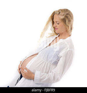 Bella donna incinta di indossare abiti casual Foto Stock