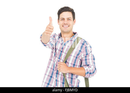 Ritratto di sorridente studente maschio che mostra un pollice in alto Foto Stock