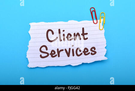 I servizi client scritto a mano su carta closeup. Foto Stock