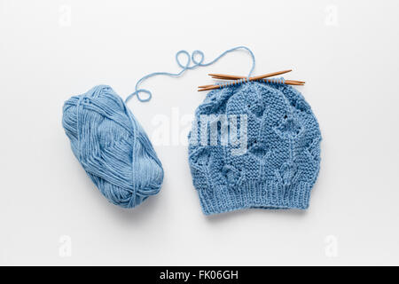 Hat a maglia con quattro aghi di tessitura Foto Stock