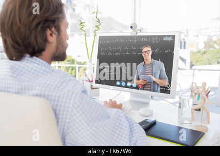 Immagine composita di desinger lavorando sul suo computer Foto Stock