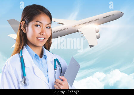 Immagine composita di asian medico tenendo negli appunti Foto Stock